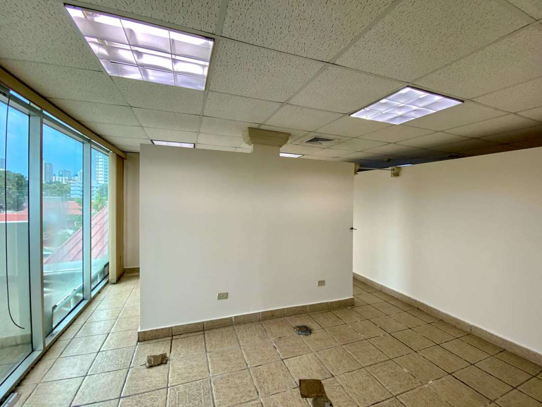 Spacious modern office area with curved panoramic windows and chandeliers San Francisco Panama