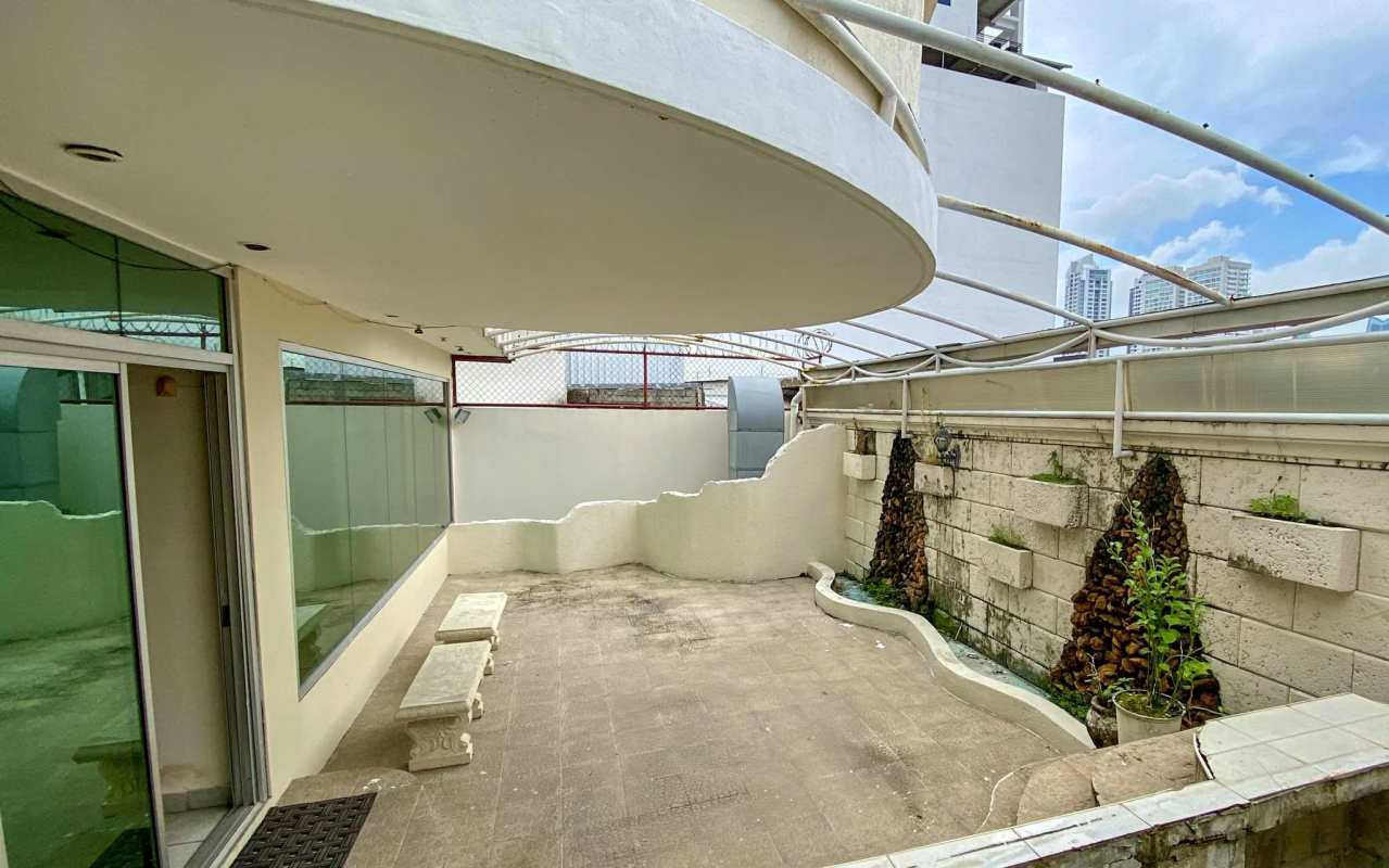 Covered patio area with water feature and stone benches Calle 72 San Francisco Panama City