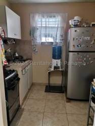 Unfurnished room with tiled floor and two covered windows Coclé