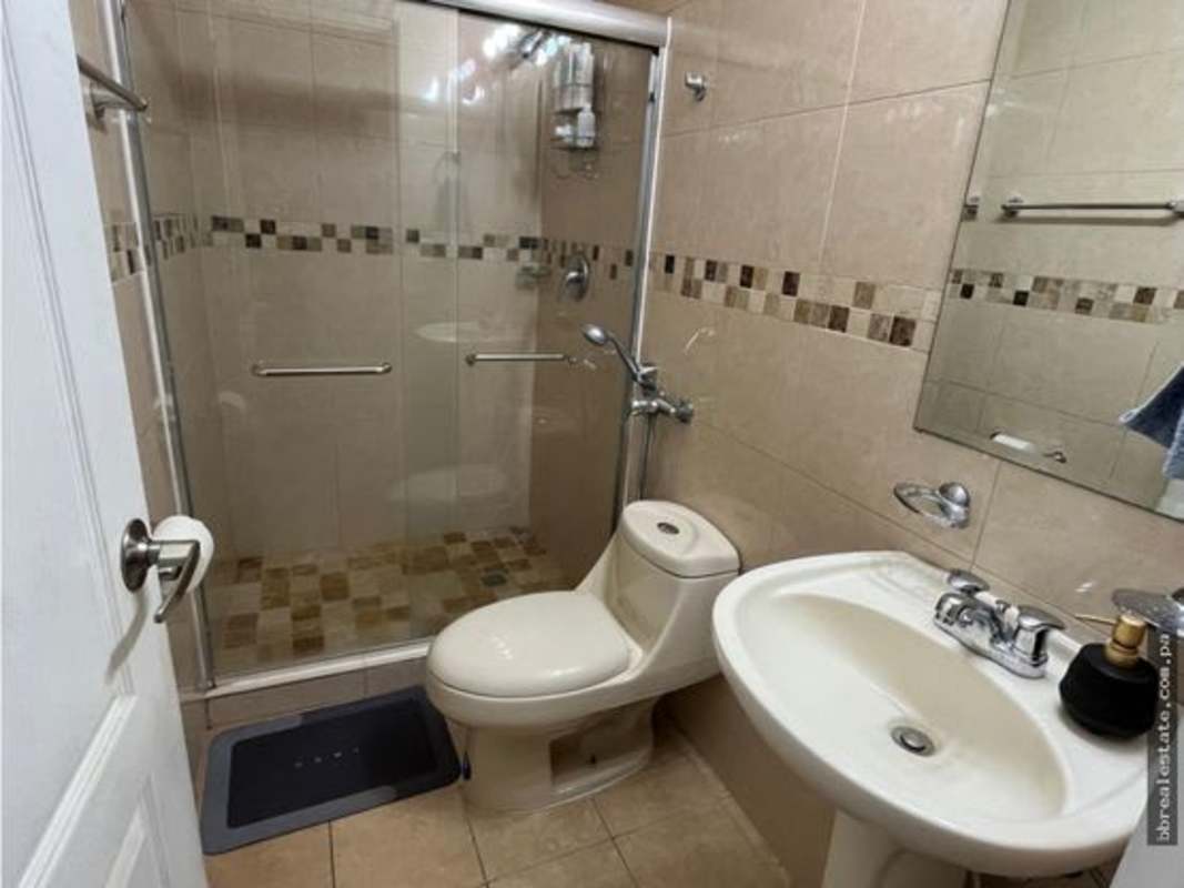 Modern bedroom with city view, large windows and tile flooring at PH San Francisco Bay Panama