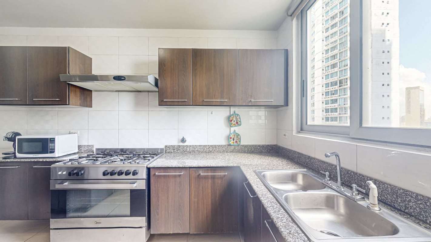 Infinity pool and jacuzzi on rooftop deck with panoramic views of Panama City at PH Belle View