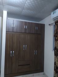 Staircase with wrought iron railing and large window in apartment building Las Tablas