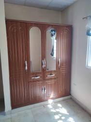 Bedroom featuring built-in mirrored wardrobe and window with curtain Las Tablas Panama