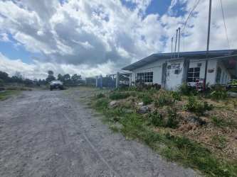 Bedroom with tiled floors, large window and closet space in Volcán Las Perlas