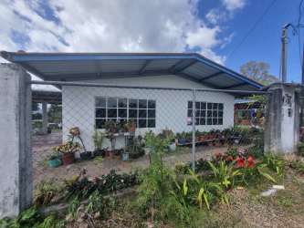 Living area with ceramic floors and large windows for natural light in Volcán Panama