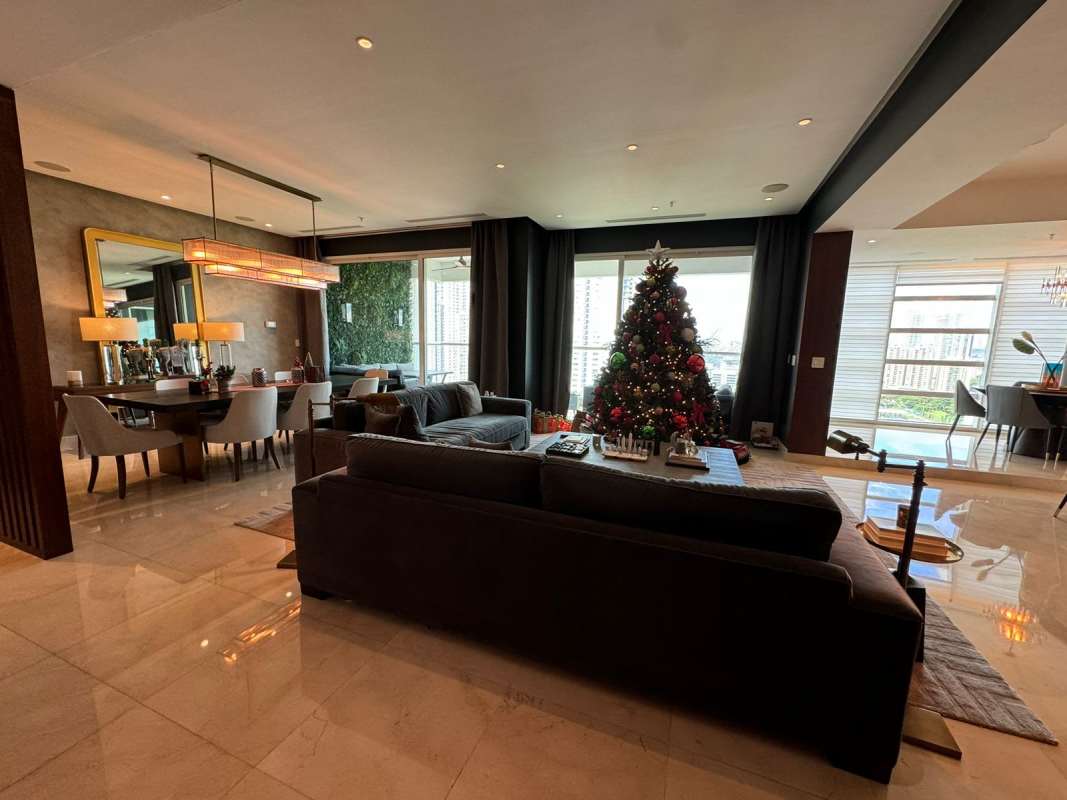 Living area featuring marble floors, custom wood, floor-to-ceiling windows at PH Ocean House