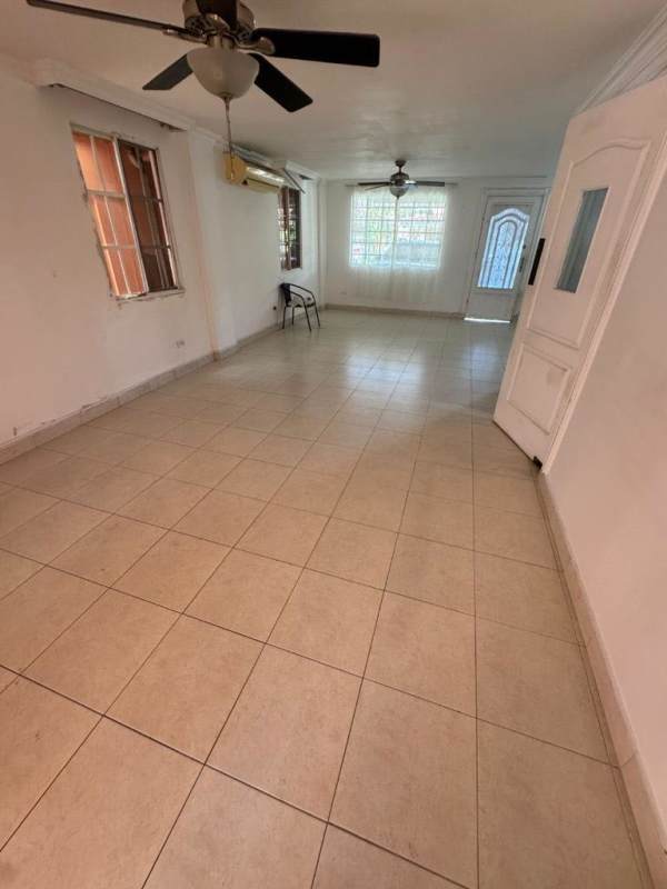 Fully equipped wood cabinetry kitchen with granite counters, stove and refrigerator in Condado del Rey Panama
