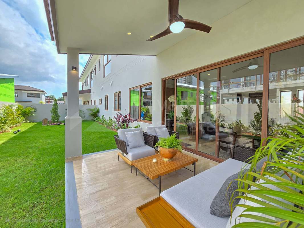 Luxury living and dining room with large windows marble floors in Santa María Panama PH The Woods