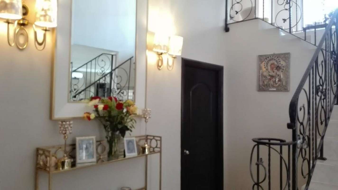 Modern dining room with marble top table and art decor in Costa del Este house Panama