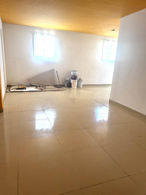 Living area with windows bright tiled floor San Miguelito apartment rental