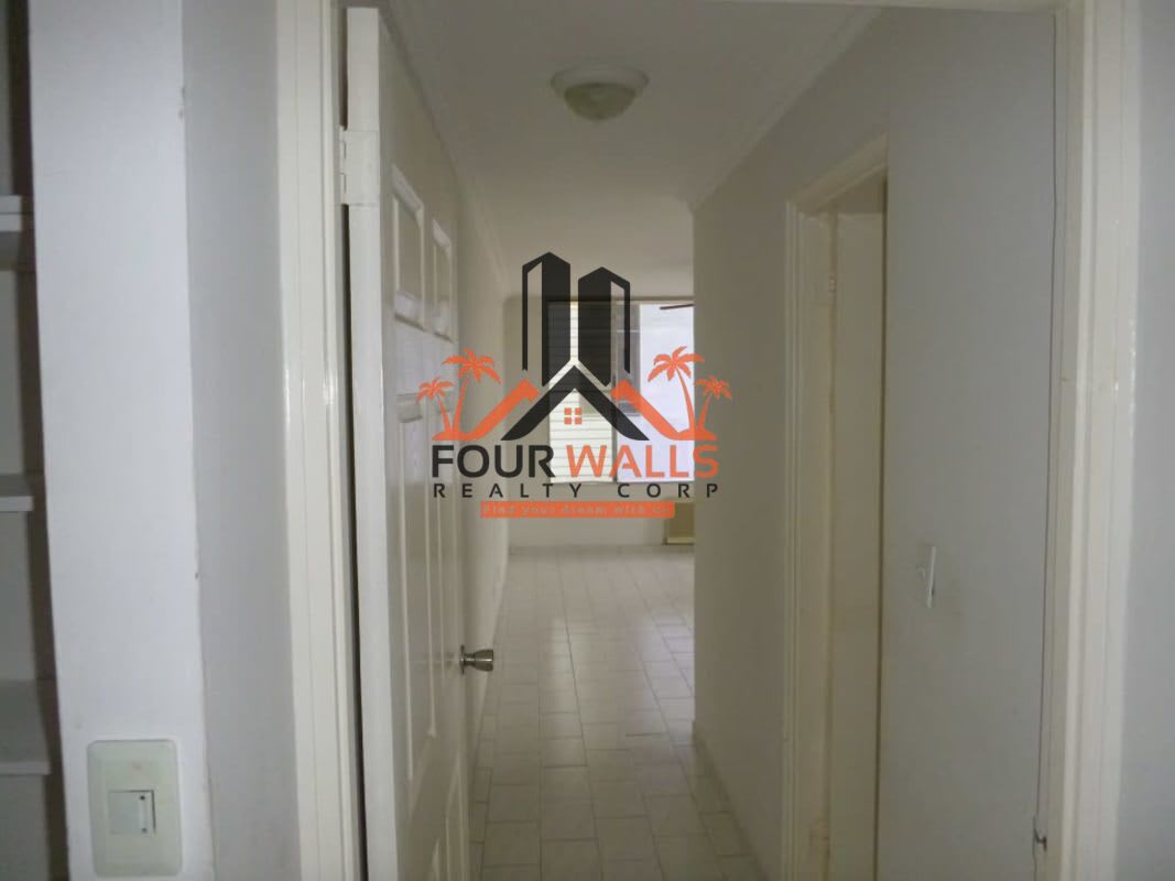 Interior hallway with tile floors leading to bedrooms in PH Ocean View San Francisco Panama