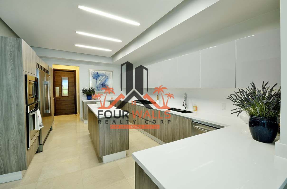 Spacious kitchen with stone countertops and contemporary cabinetry at PH Green Garden Panama