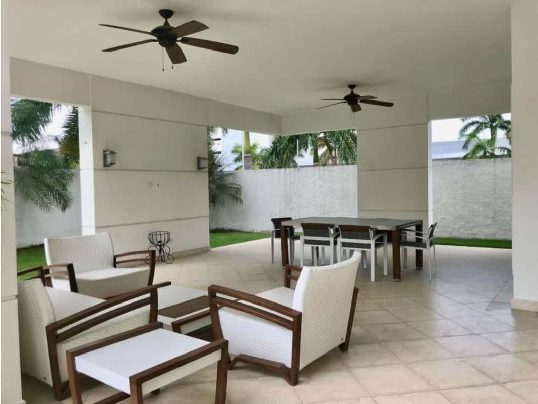 Spacious covered terrace with fans and furniture next to pool Costa del Este Panama