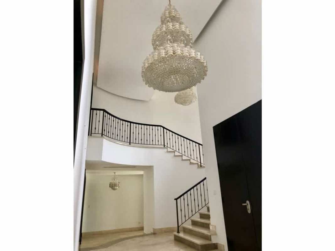 Kitchen with granite countertops, modern cabinetry, breakfast island in luxury Costa del Este house