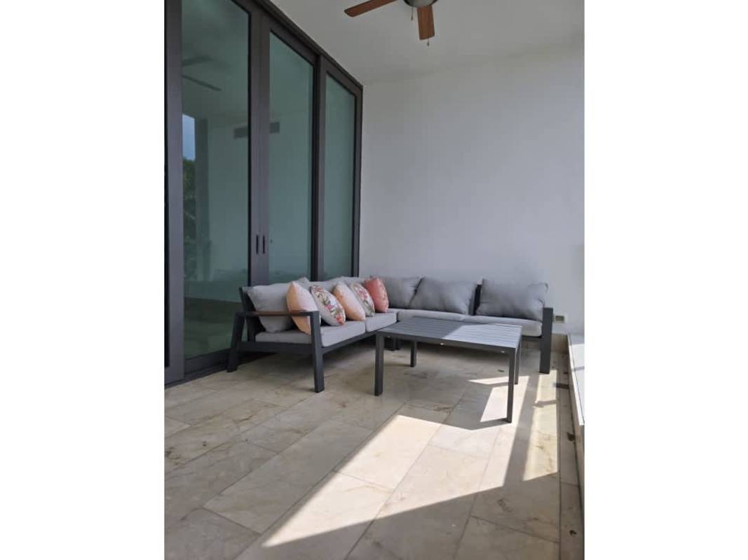 Covered terrace with seating and panoramic views of golf course at PH Valery Point Santa María Panama