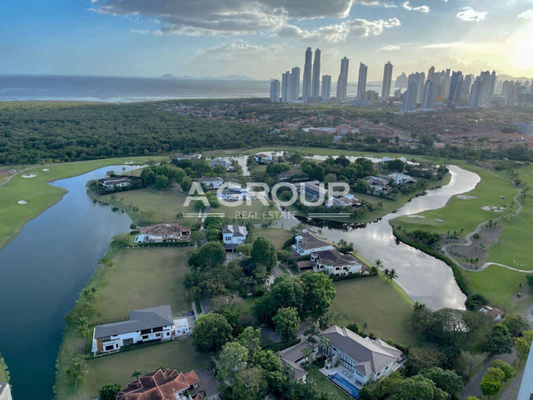 Luxury residential community aerial with lakes, golf course, lush greenery at Santa María Panama