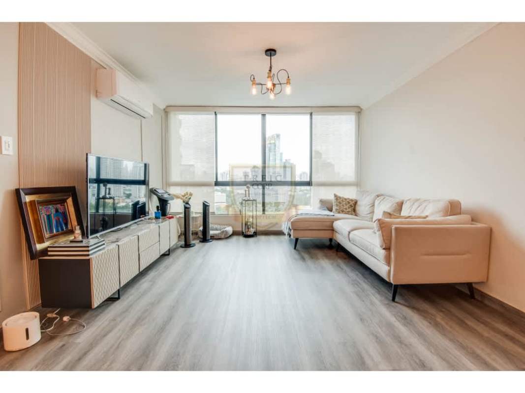 Living dining room with wood flooring city skyline view PH Mirasol Punta Paitilla Panama