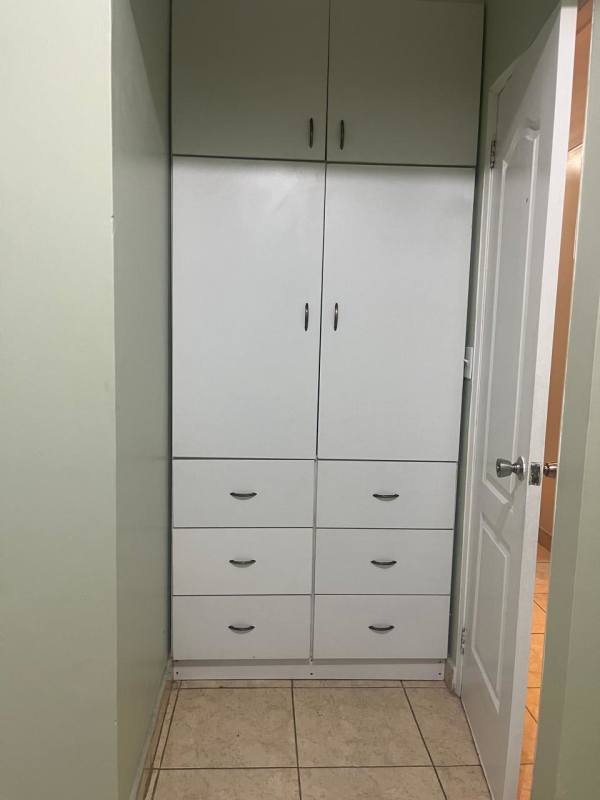 Built-in closet and cabinets in bedroom of San Antonio house Panama City