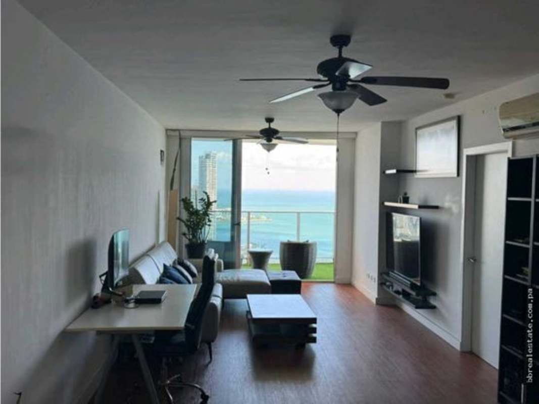 Bright living area with ocean view windows in PH White Tower Panama City