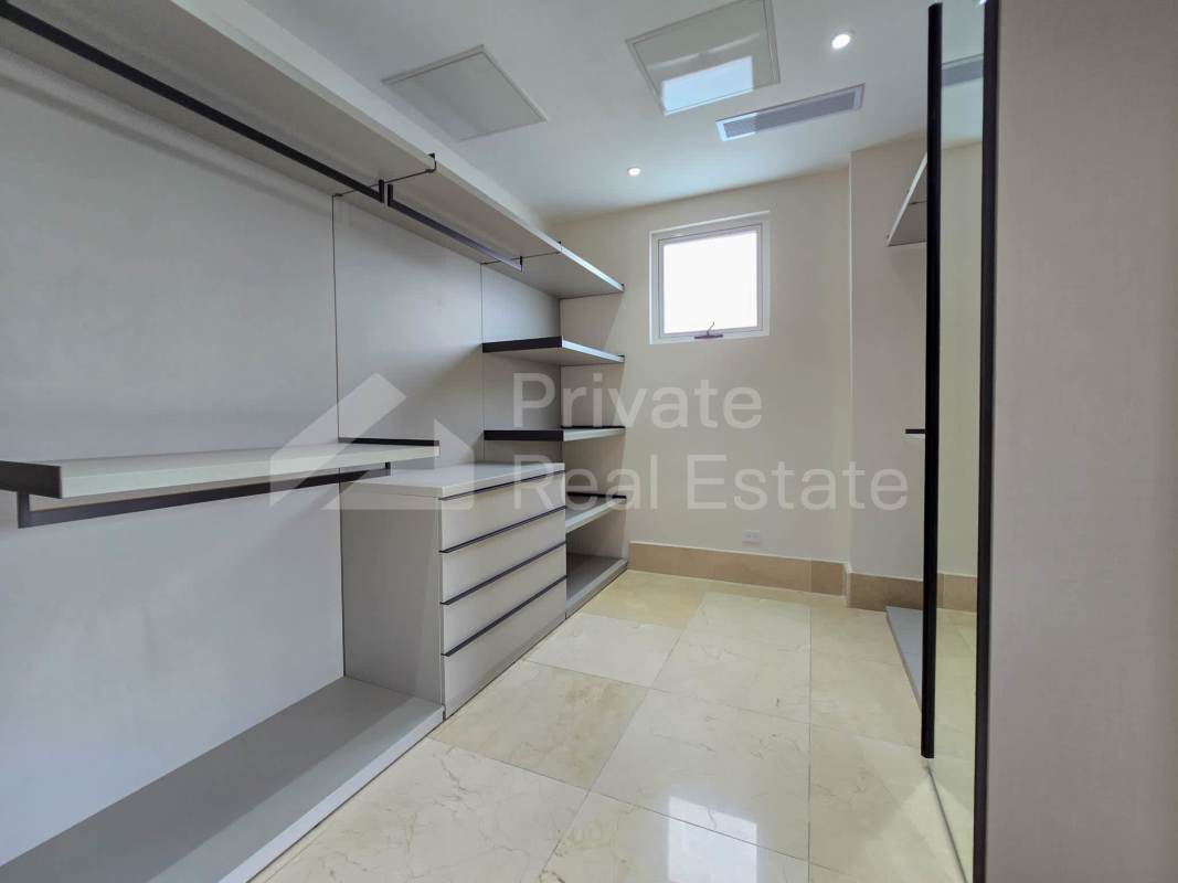 Master bedroom with marble floors, balcony access and golf course views at The Reserve Panama