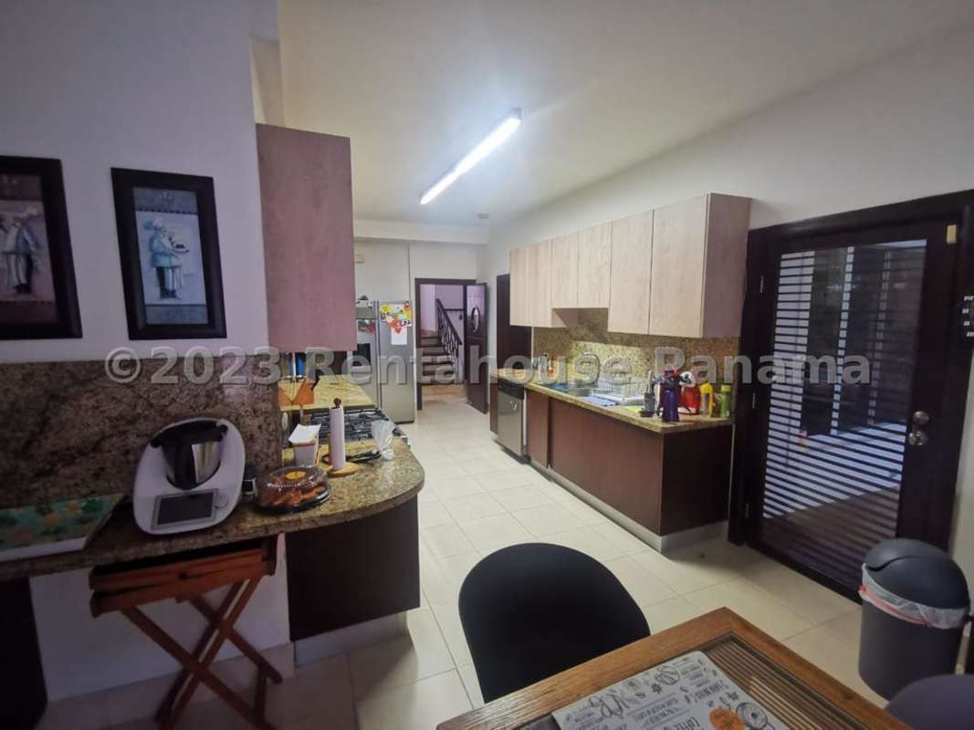 Bright dining area with large windows and pool view in luxury Panama City house