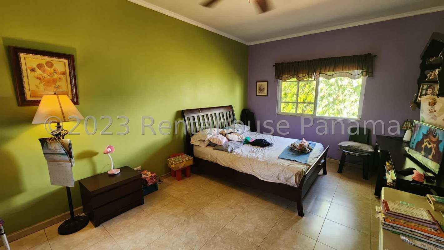Contemporary kitchen with cabinetry and stone counters in Costa del Este Panama house