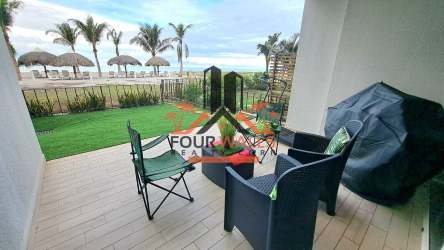Covered terrace with ocean view, outdoor seating, green lawn PH Playa Caracol Sanctuary Tower Nueva Gorgona Panama