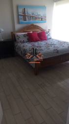 Bedroom with bright window, tile floors, decor PH Playa Caracol Nueva Gorgona Panama