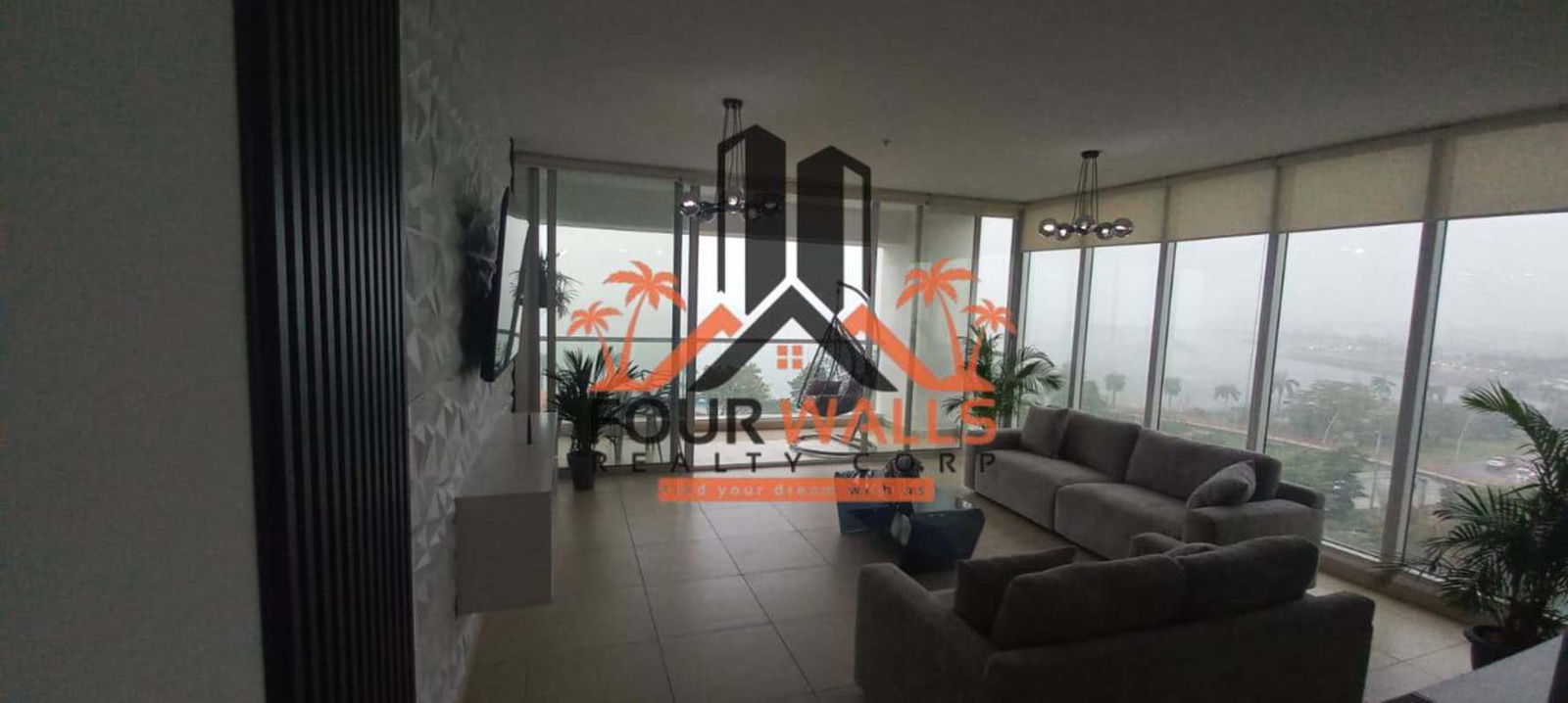 Bright luxury living room with ocean view balcony in PH Rivage Avenida Balboa Panama City