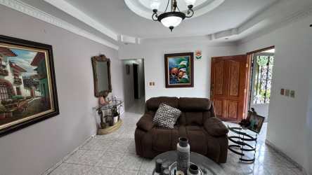 Traditional kitchen with wooden cabinetry, granite countertop and tiled floor Las Tablas Panama