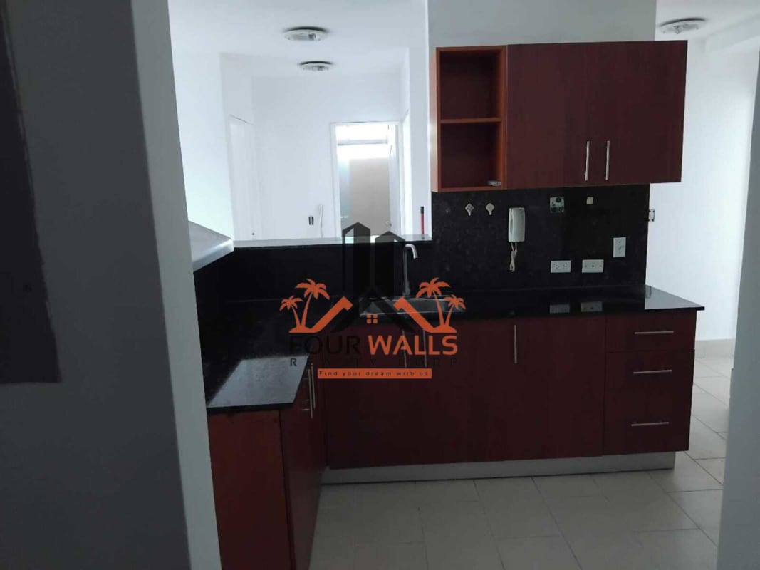 Kitchen area with granite and dark cabinetry in PH Met View apartment Panama
