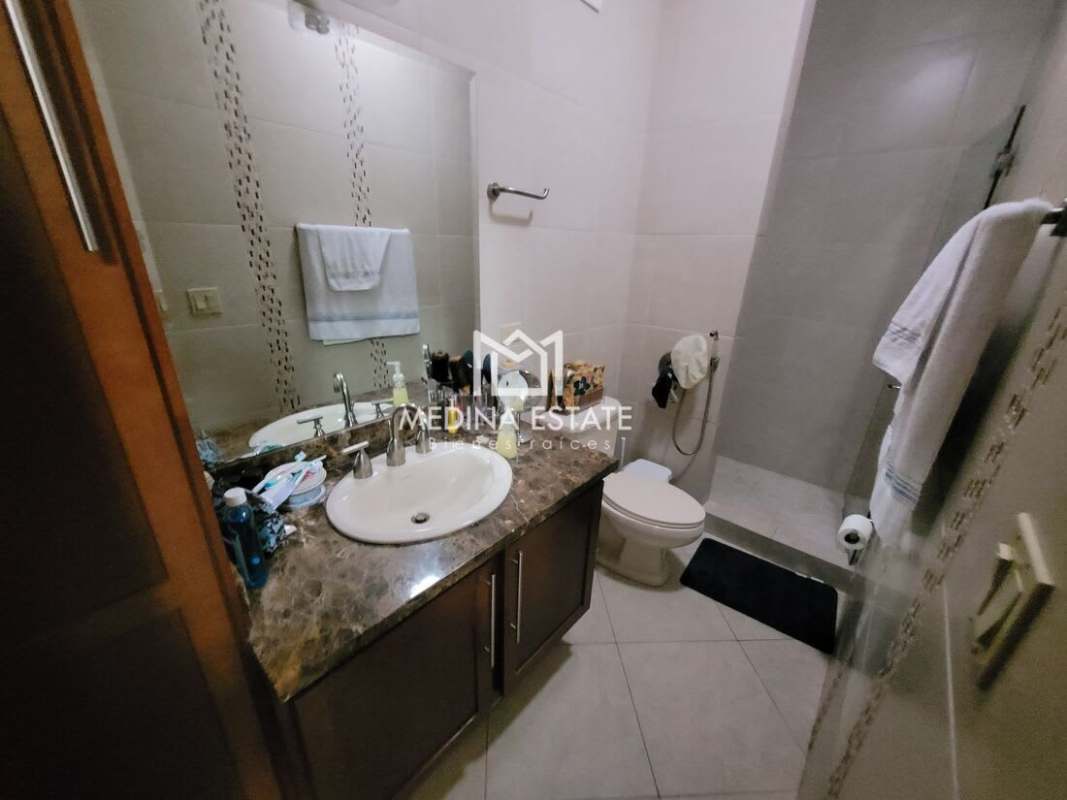 Bathroom with granite countertop and glass shower Embassy Club Clayton Panama