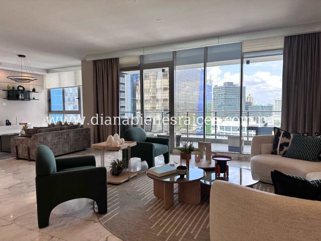 Modern dining area with marble flooring and designer chandelier in PH Santa Maria Country Club Costa del Este