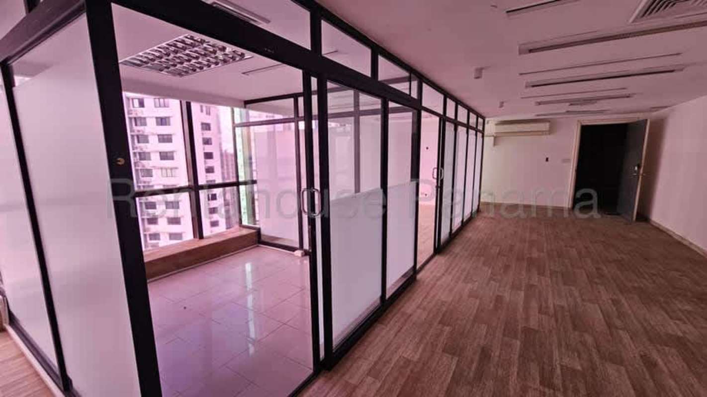 Modern commercial office with glass walls and large windows at BBVA Tower Panama