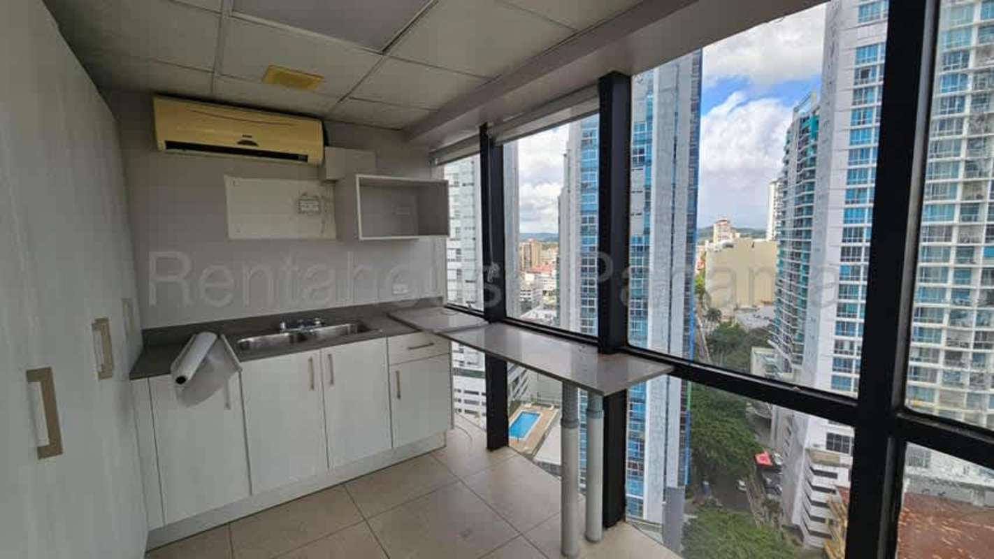 Reception area in commercial office at BBVA Tower Panama City with glass wall and modern design