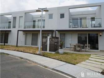 Modern two-story townhouse exterior with balconies and patios in Playa Caracol Punta Chame