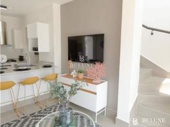 Modern open concept living/dining with fitted kitchen at PH The Tides Playa Caracol Panama