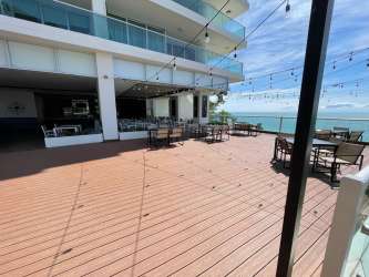 Open plan living dining with porcelain tile floors and balcony access at PH Royal Palm Playa Gorgona Panama