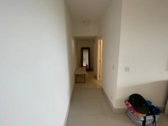 Wide hallway with tile floor and neutral decor Punta Caelo condo San Carlos Panama