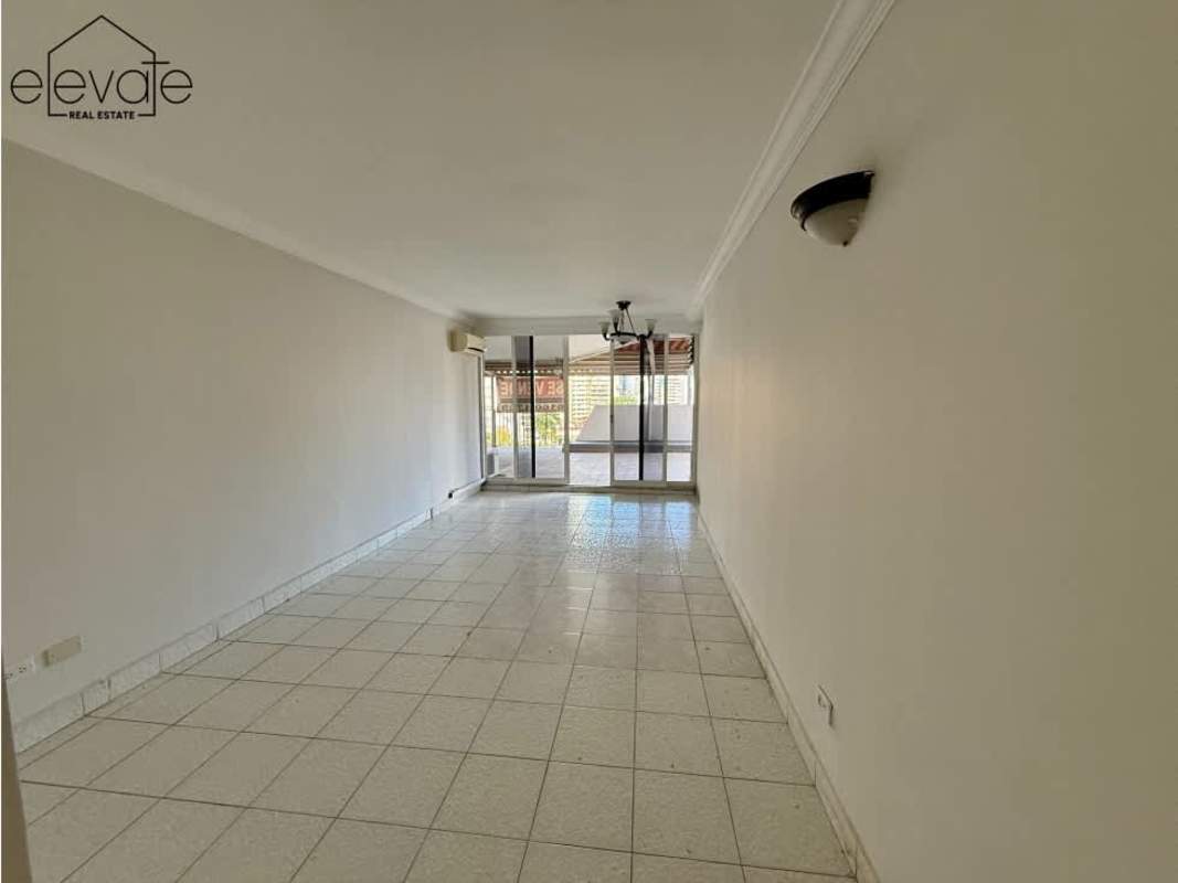 Large covered balcony overlooking Panama City skyline and Pacific Ocean in luxury apartment PH Tamanaco Punta Paitilla