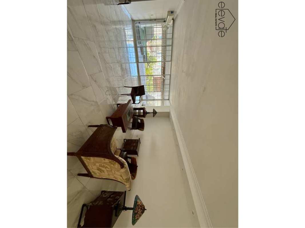 Modern remodeled kitchen with granite countertops and ample natural light in luxury apartment PH Tamanaco Punta Paitilla Panama