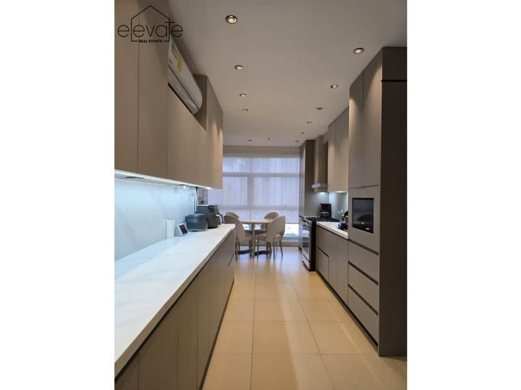 Open dining area with marble floors and oceanfront balcony PH Q Tower Punta Pacifica Panama