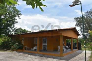 Rustic front porch with covered roof and hammock at Playa Malibu Gorgona beach home for sale
