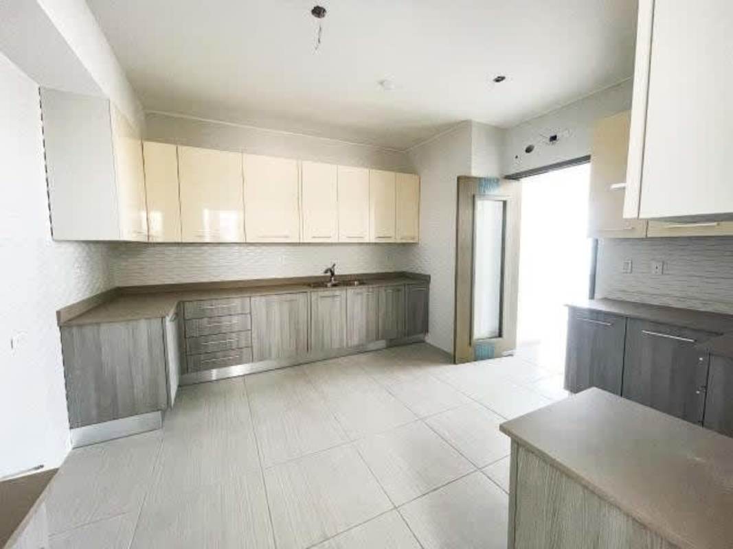 Bright bedroom with large windows and ensuite bath at The Towers Calle 50 Panama