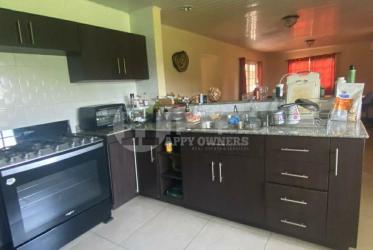 Modern kitchen with granite countertops wooden cabinets Altos del Fraile