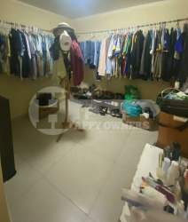 Bathroom with red tiles and unique wallpaper rental house Altos del Fraile