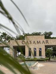 Mediterranean style entrance gate with Casamar sign and palms San Carlos Panama