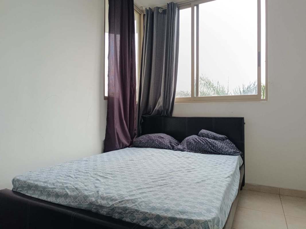 Bedroom with large windows, tile flooring, built-in closet, and AC at PH San Francisco Bay Panama City