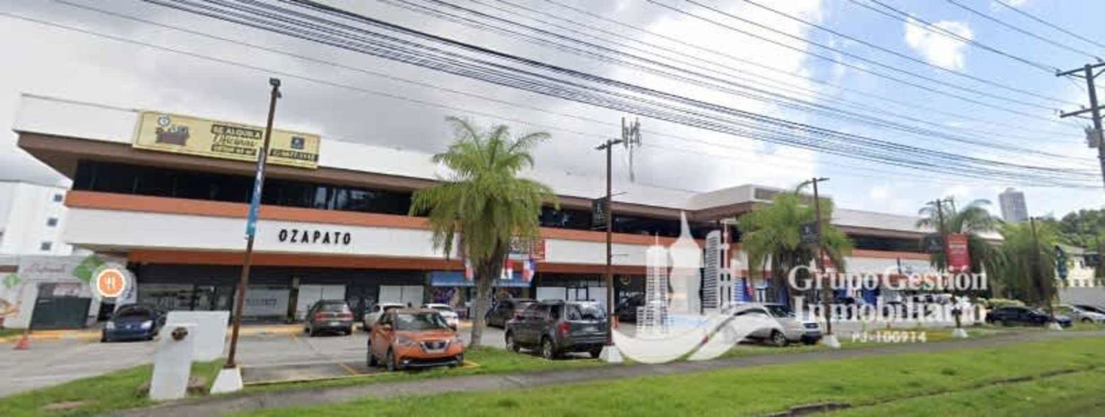 Commercial building facade with glass and parking, Albrook Commercial Park, Panama City