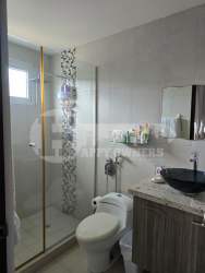 View of outdoor pool surrounded by gardens at PH Rio Mar Villages San Carlos Panama